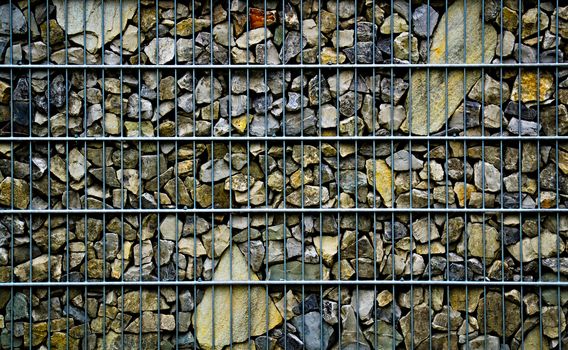 background or texture stones trapped in a metal net