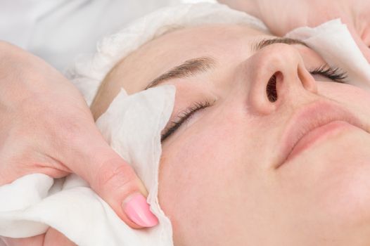 beauty salon, facial mask wiping, removing with napkins