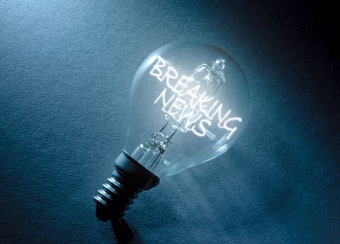 Breaking news light bulb concept 
