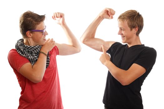 Two teenage boys showing off their muscles