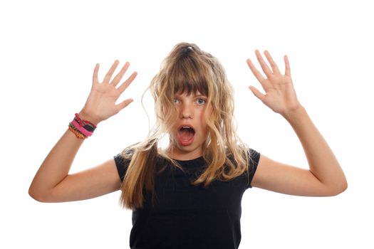 A shocked teenage brunette girl with messy hair