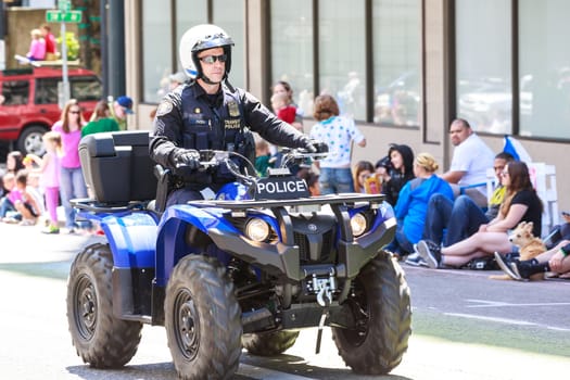 Portland, Oregon, USA - JUNE 7, 2014: Portland Police Bureau in Grand floral parade through Portland downtown.