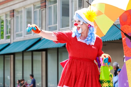 Portland, Oregon, USA - JUNE 7, 2014: Rose Festival Clown Prince in Grand floral parade through Portland downtown.