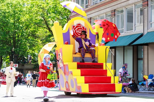 Portland, Oregon, USA - JUNE 7, 2014: Rose Festival Clown Prince in Grand floral parade through Portland downtown.