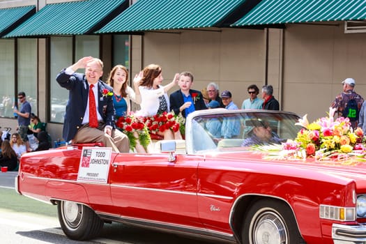 Portland, Oregon, USA - JUNE 7, 2014: Rose Festival President, Todd Johnston in Grand floral parade through Portland downtown.