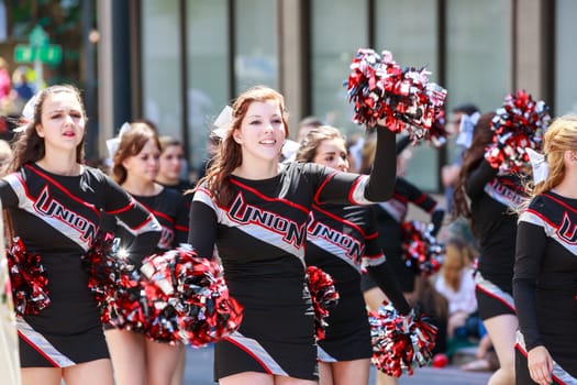 Portland, Oregon, USA - JUNE 7, 2014: Union High School Marching Band in Grand floral parade through Portland downtown.