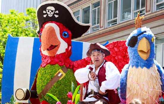 Portland, Oregon, USA - JUNE 7, 2014: Character Clown Corps in Grand floral parade through Portland downtown.