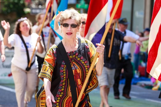Portland, Oregon, USA - JUNE 7, 2014: Columbia River Peace Corps in Grand floral parade through Portland downtown.
