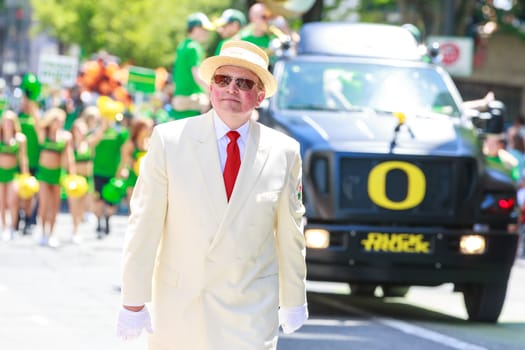 Portland, Oregon, USA - JUNE 7, 2014: University of Oregon Duck Truck in Grand floral parade through Portland downtown.