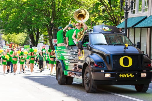 Portland, Oregon, USA - JUNE 7, 2014: University of Oregon Duck Truck in Grand floral parade through Portland downtown.