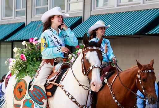 Portland, Oregon, USA - JUNE 7, 2014: Northwest Youth Rodeo Association Court in Grand floral parade through Portland downtown.