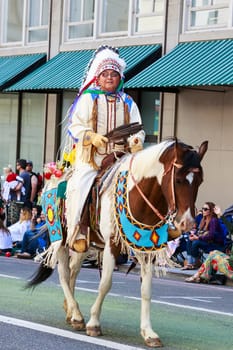 Portland, Oregon, USA - JUNE 7, 2014: The Confederated Tribes of Warm Springs in Grand floral parade through Portland downtown.