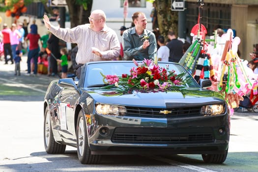 Portland, Oregon, USA - JUNE 7, 2014: Oregon Teacher of the Year, Brett Bigham in Grand floral parade through Portland downtown.