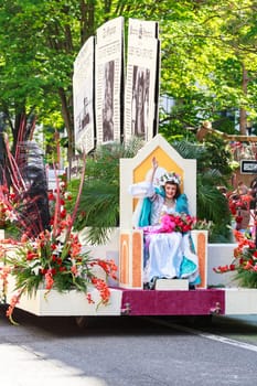 Portland, Oregon, USA - JUNE 7, 2014: The Oregonian Float 
in Grand floral parade through Portland downtown.