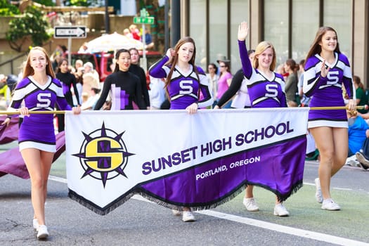 Portland, Oregon, USA - JUNE 7, 2014: Sunset High School Marching Band in Grand floral parade through Portland downtown.