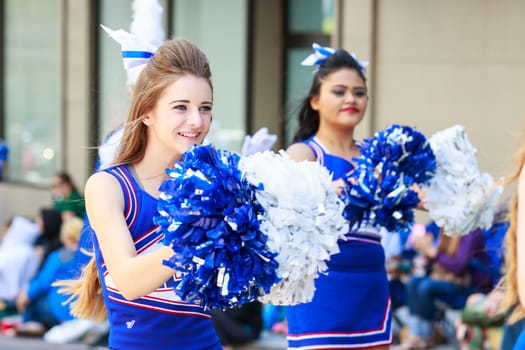 Portland, Oregon, USA - JUNE 7, 2014: Hillsboro High School Marching Band in Grand floral parade through Portland downtown.