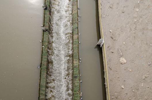 closeup radial settler at wastewater sewage water treatment plant.