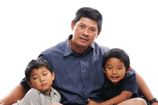 Asian father cuddles his two sons