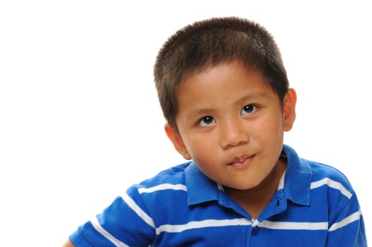 Asian boy wearing blue shirt looking naughty