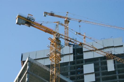 Elevating cranes on the construction site of Moscow business center