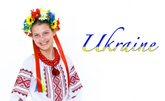 Portrait of happy cute girl in the Ukrainian national costume. Isolated white background