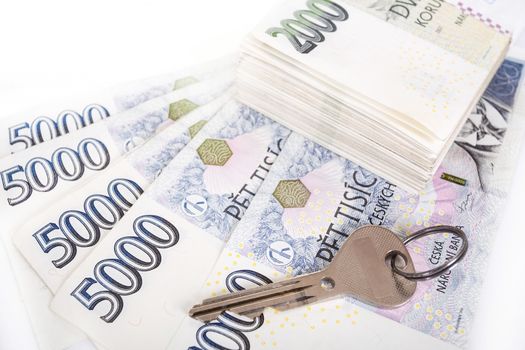 czech banknotes nominal value one and two thousand crowns and key as money concept key to Success