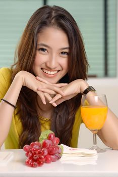 Asian young women cute woman drinking orange juice