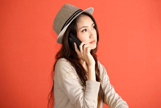 Young Asian woman calling smartphone