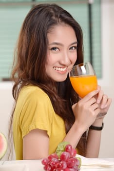 Asian young women cute woman drinking orange juice