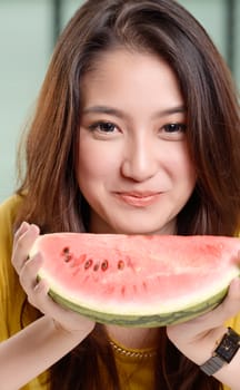 Young Asian cute woman and Eating watermelon