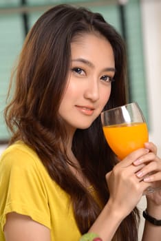 Asian young women cute woman drinking orange juice