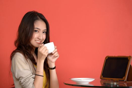 Young Asian cute woman Drinking hot Coffee