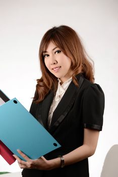 Asian Businesswoman give a folder and smile