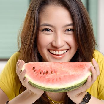 Young Asian cute woman and Eating watermelon