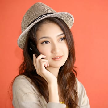 Young Asian woman calling smartphone