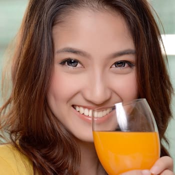 Asian young women cute woman drinking orange juice