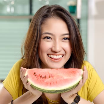 Young Asian cute woman and Eating watermelon