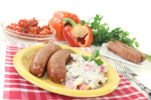 pasta salad with bell pepper and Mettenden on a light background