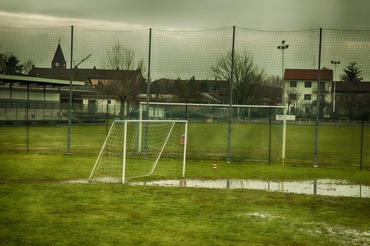 Football field with big pool of water, hdr image