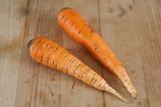 two Carrots on wooden board