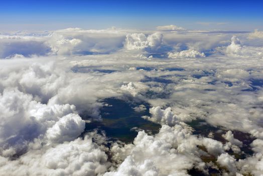 Blue sky and clouds. Top view of aircraft