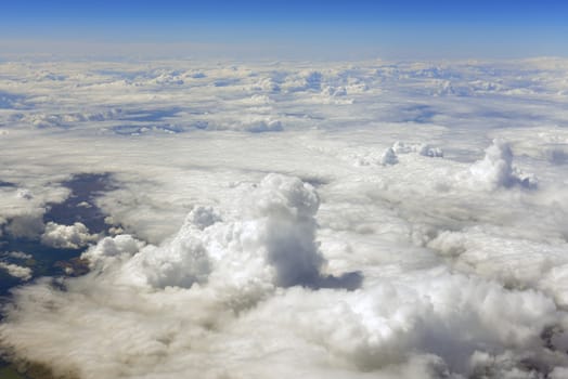 Blue sky and clouds. Top view of aircraft