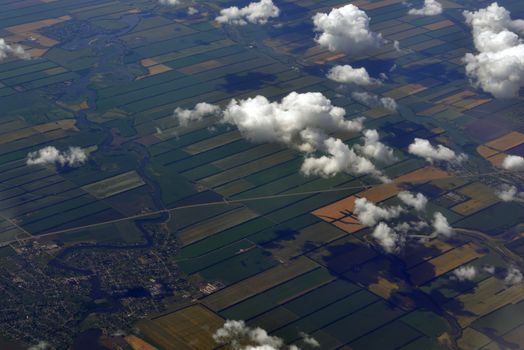 Earth's surface and clouds. Top view of aircraft