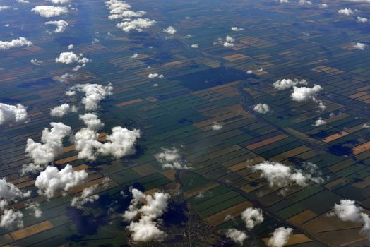 Earth's surface and clouds. Top view of aircraft