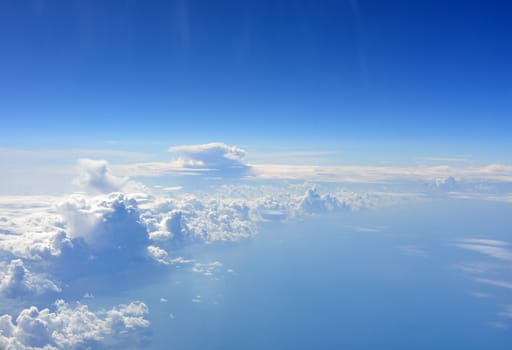 Blue sky and clouds. Top view of aircraft