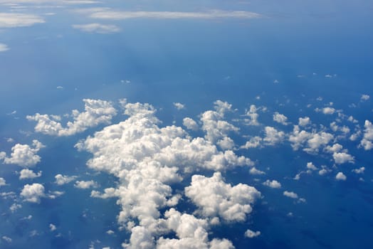 Blue sky and clouds. Top view of aircraft