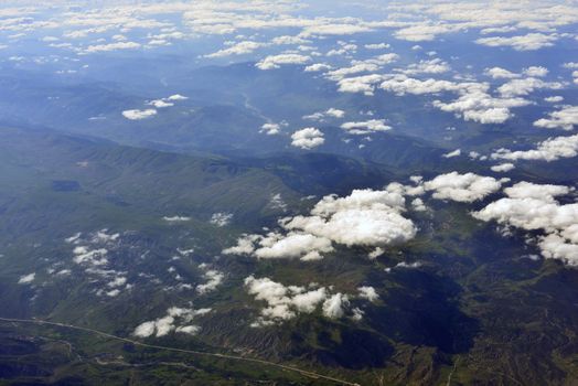 Earth's surface and clouds. Top view of aircraft