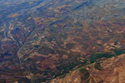 Earth's surface. Colorful fields. Top view of aircraft