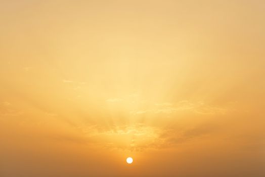 Sunset or sunrise. Yellow warm sky background