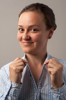 portrait of a smiling woman on grey background